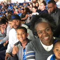 Family sitting and watching the Lions game